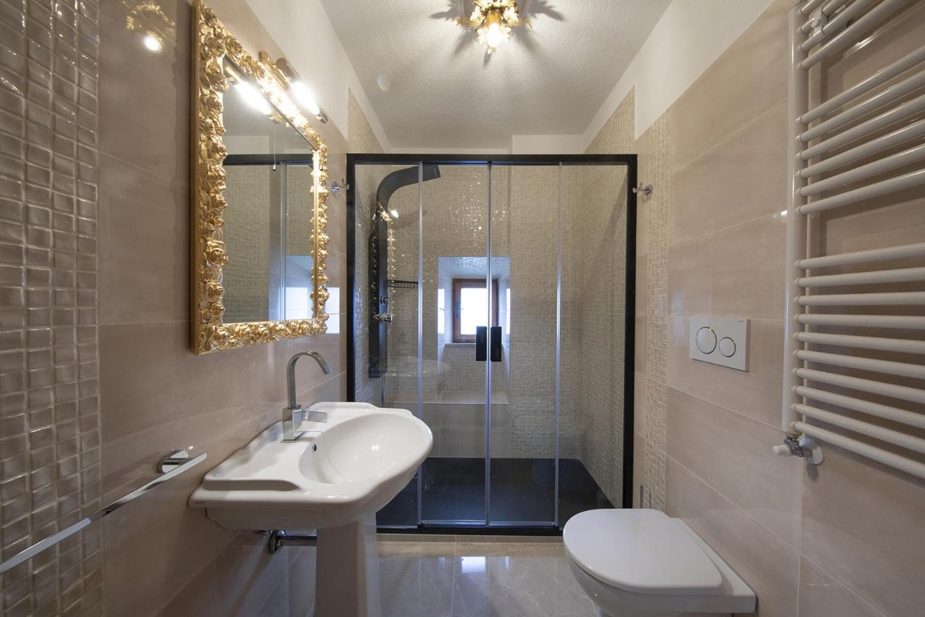 The large bathroom of the Contessa Rossa, with cascading shower