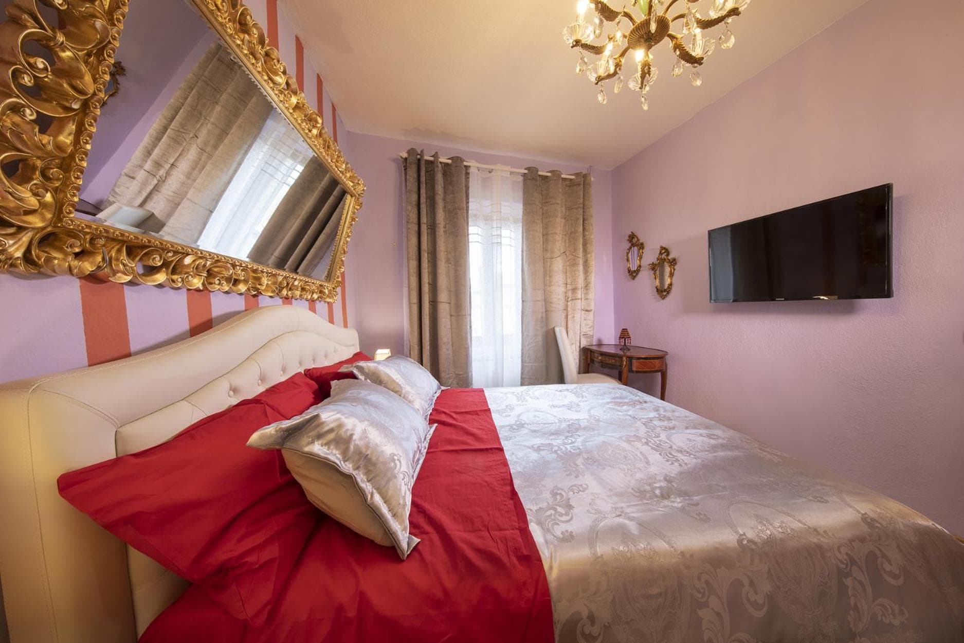 The bedroom of the Contessa Rossa, in shades of red